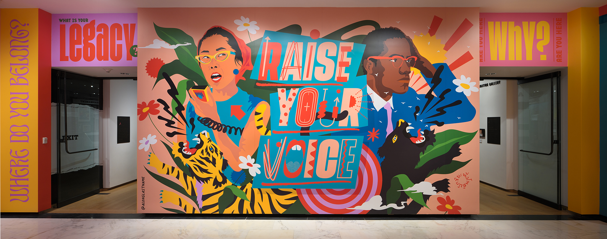 Photograph of the immersive installation "Raise Your Voice," original artwork of activists and allies Yuri Kochiyama and Malcolm X by artist Amanda Phingbodhipakkiya.